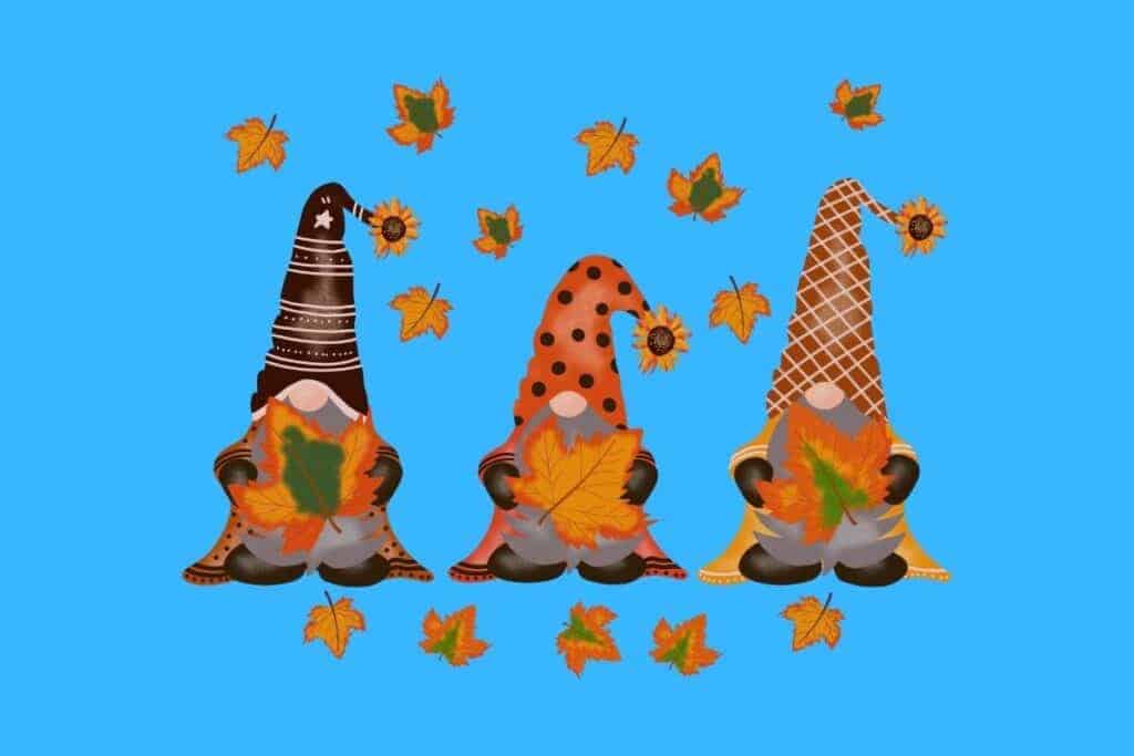 Cartoon graphic of 3 dwarves holding autumn leaves on blue background.