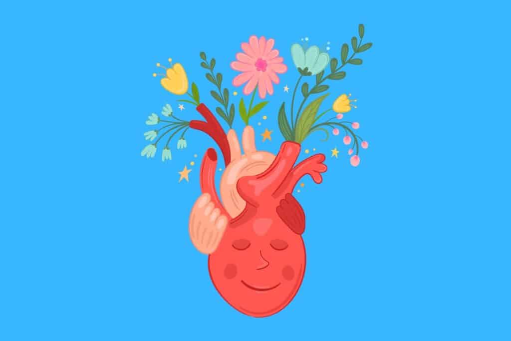 Cartoon graphic of human heart with flowers growing out of it on blue background.