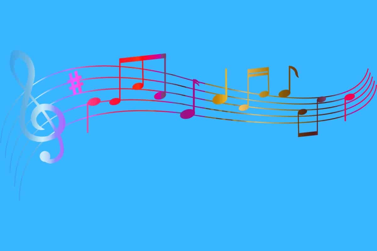 Cartoon graphic of rainbow colored sheet music on blue background.