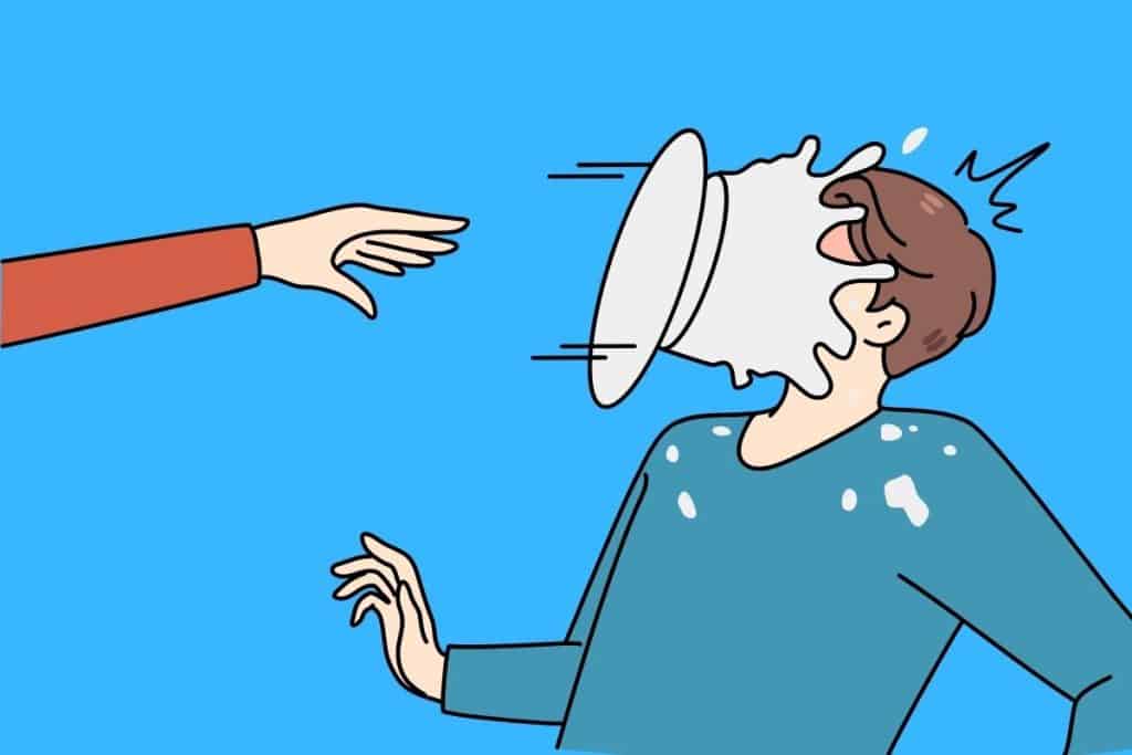 Cartoon graphic of a pie being thrown and hitting a person in the face on blue background.