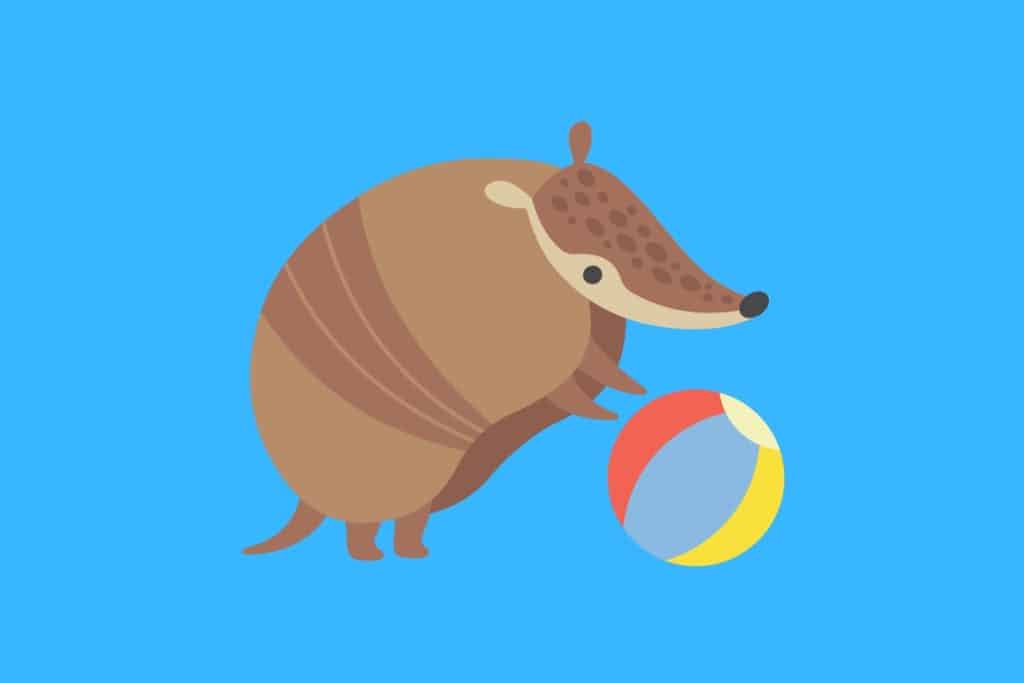 Cartoon graphic of an armadillo with its front feet on a rainbow colored ball on a blue background.