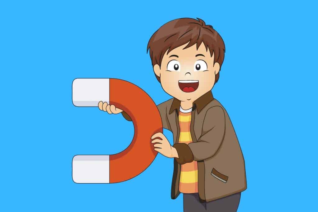 Cartoon graphic of a boy holding a large magnet on a blue background.