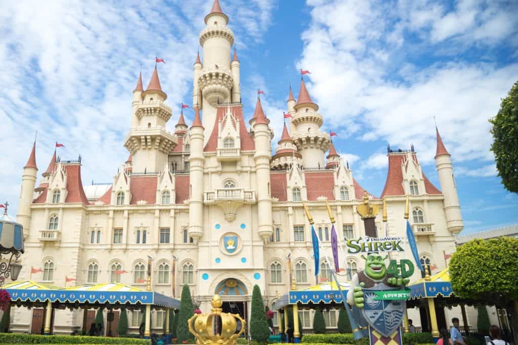 Photo of a Disney castle with a Shrek 4D sign outside.