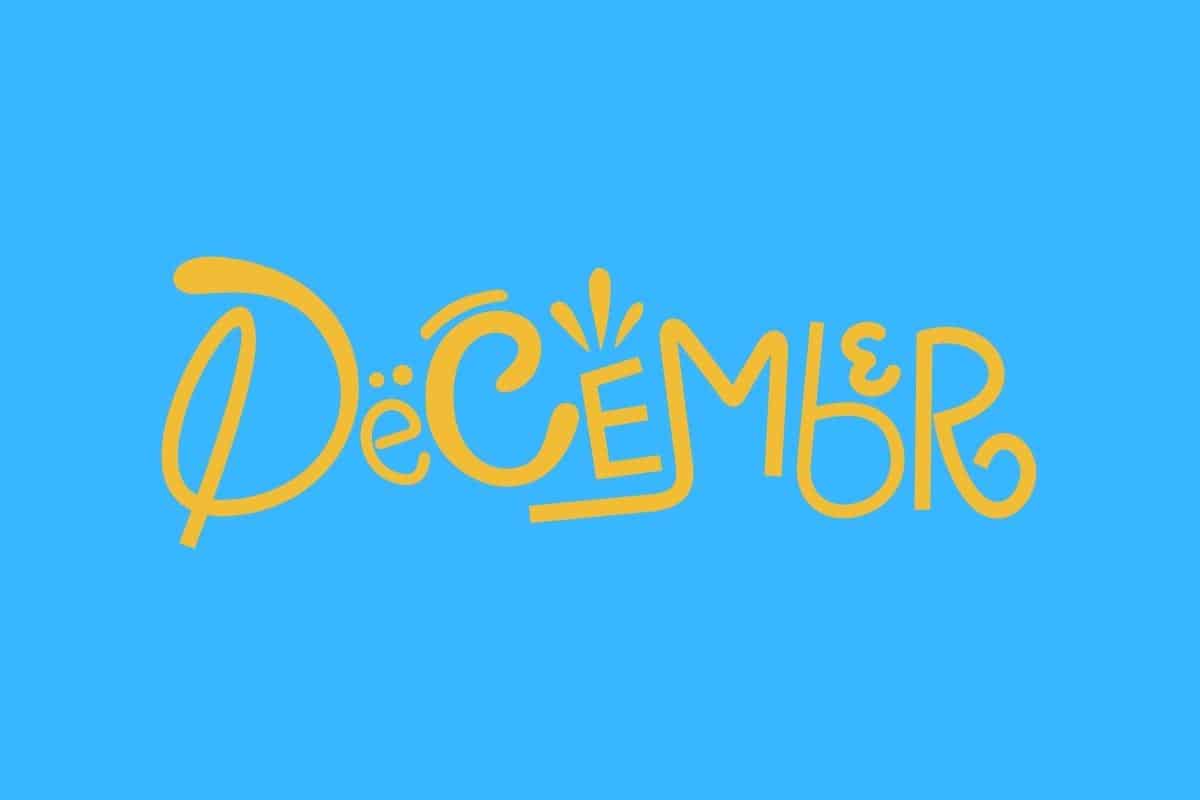 Cartoon graphic of gold-colored word of December on a blue background.